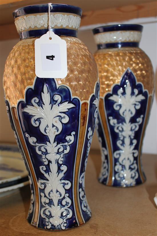 Pair of Royal Doulton cobalt blue and gilt baluster vases, with white applied decoration (1 rim restored)(-)